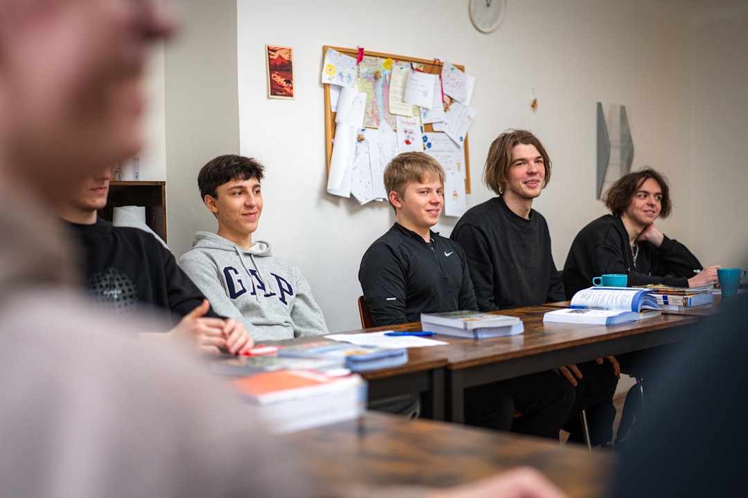 Students sitting together at a table working through a group assignment
